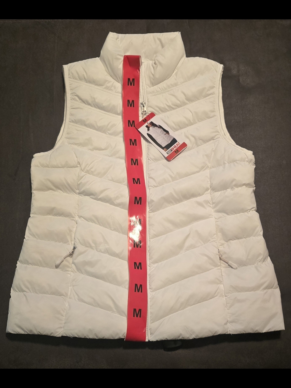 This is a 32 Degrees Heat Women's Lightweight Chevron Quilt Puffer Vest in white